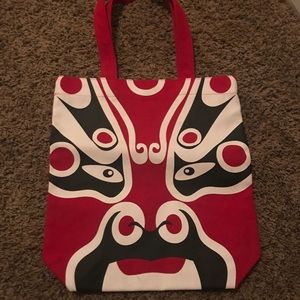 Red, black, and white tote.
